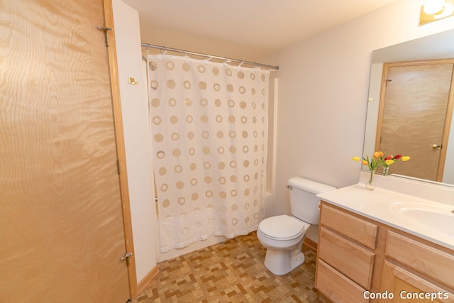 full bathroom with toilet, shower / tub combo with curtain, and vanity