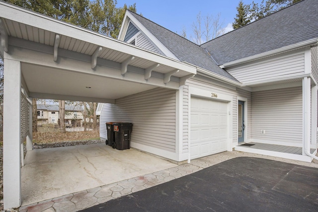 garage featuring aphalt driveway