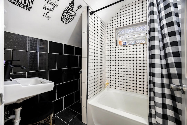 full bath with shower / bathtub combination with curtain, tile walls, and vaulted ceiling