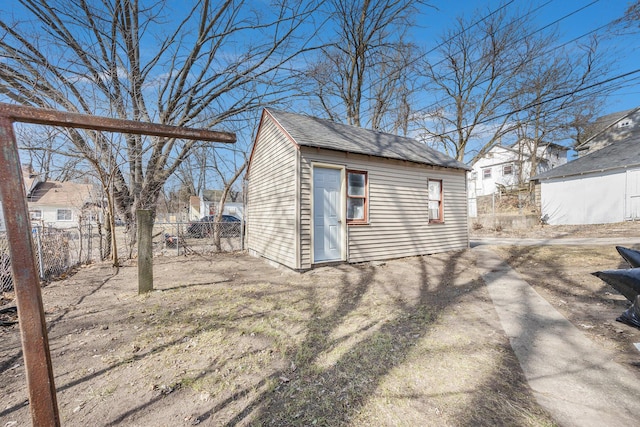 view of outbuilding with an outbuilding and fence