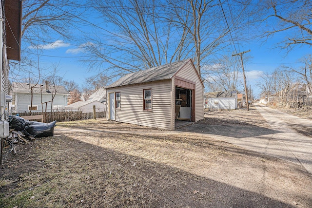 view of shed with fence