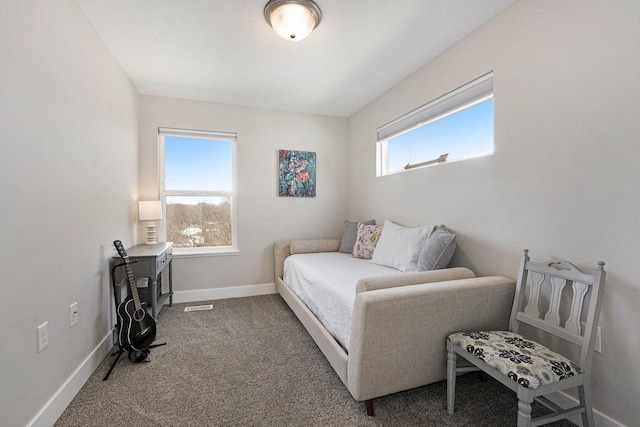 bedroom featuring baseboards, carpet floors, and visible vents