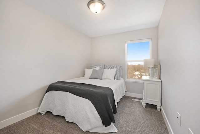 carpeted bedroom with baseboards