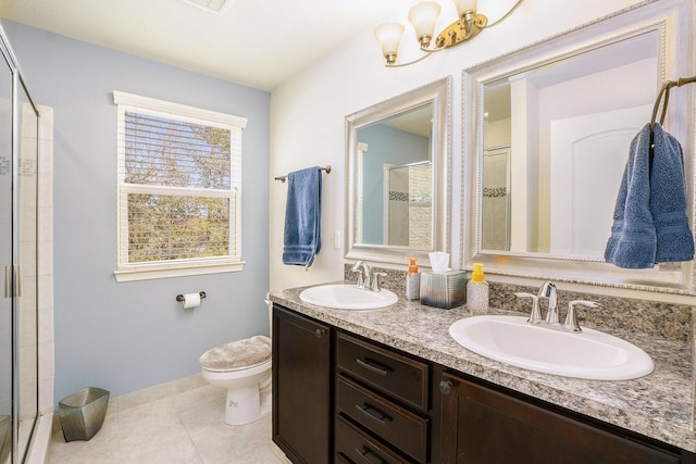 full bath with a sink, toilet, a shower stall, and tile patterned floors