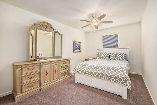 carpeted bedroom featuring a ceiling fan and baseboards