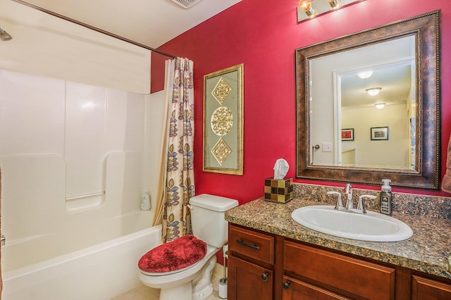 bathroom featuring visible vents, shower / bath combination with curtain, toilet, and vanity