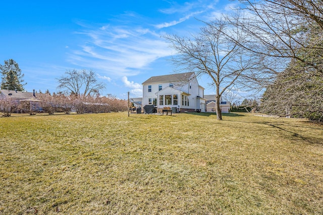 rear view of house with a lawn