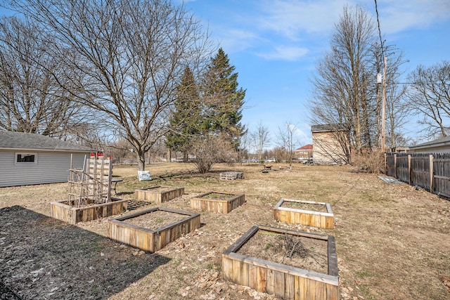 view of yard with a garden and fence