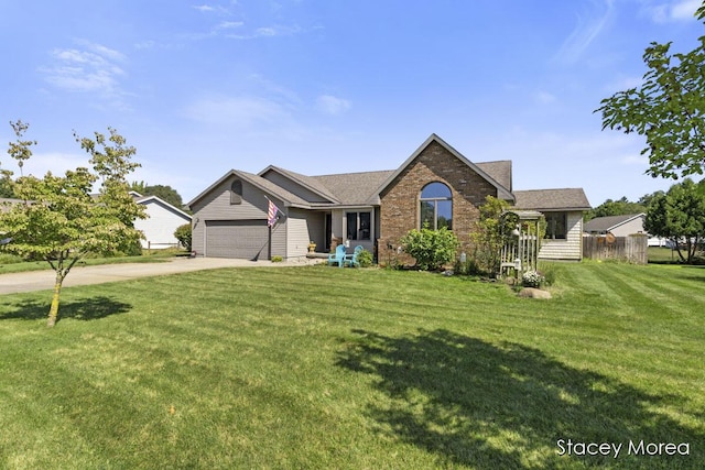 ranch-style house featuring a front lawn, fence, concrete driveway, an attached garage, and brick siding