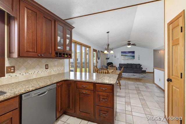 kitchen featuring a peninsula, vaulted ceiling, open floor plan, stainless steel dishwasher, and tasteful backsplash