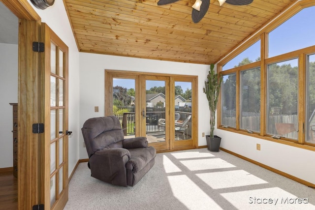 sunroom featuring lofted ceiling, french doors, wooden ceiling, and ceiling fan