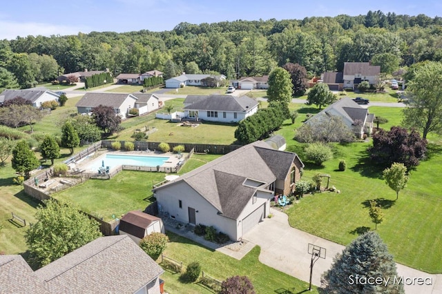 aerial view featuring a wooded view