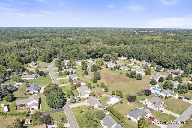 aerial view with a forest view and a residential view