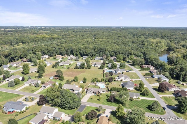 aerial view with a residential view and a view of trees