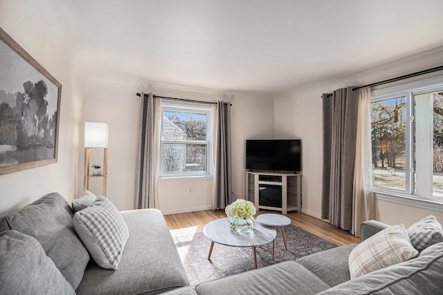 living room featuring light wood-style floors and baseboards