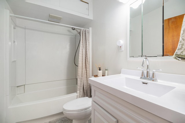 full bath featuring vanity, toilet, visible vents, and shower / bath combo