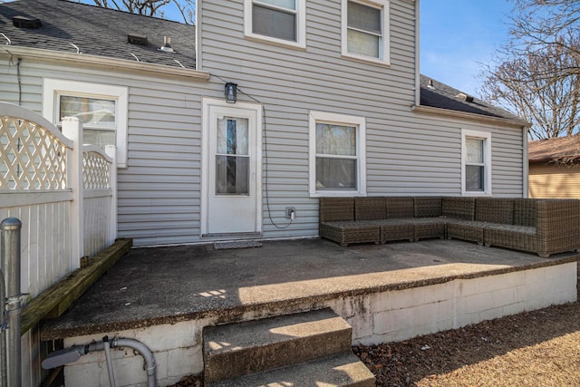 back of house featuring a patio area, an outdoor hangout area, roof with shingles, and fence