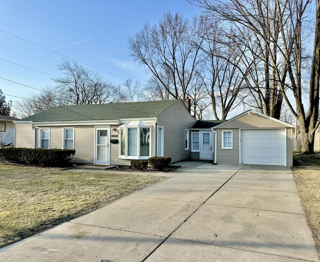 ranch-style home featuring a front yard, driveway, and a chimney