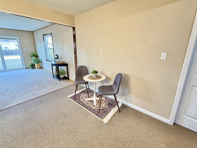 sitting room with carpet and baseboards