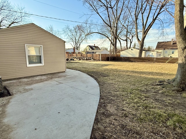 view of yard with fence and a patio area