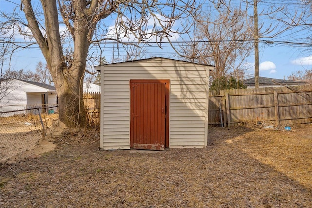 view of shed with a fenced backyard