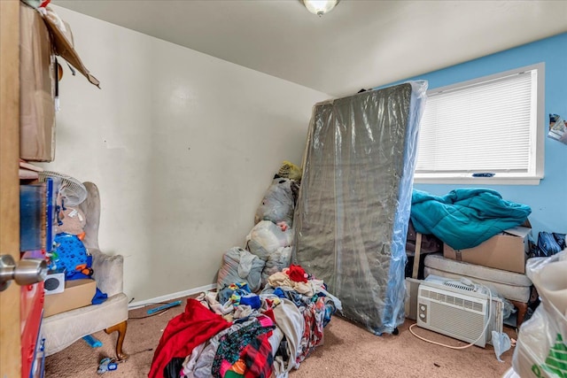 carpeted bedroom with a wall mounted air conditioner