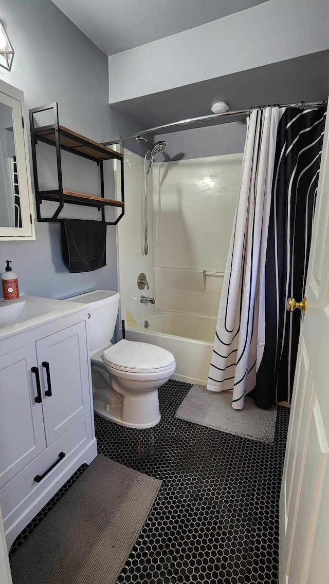 bathroom featuring vanity, toilet, shower / bath combo, and tile patterned flooring