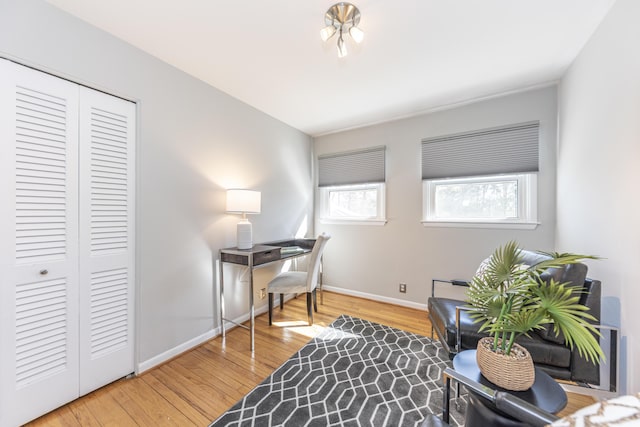 office featuring baseboards and wood finished floors