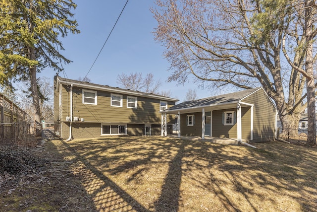 rear view of property with fence