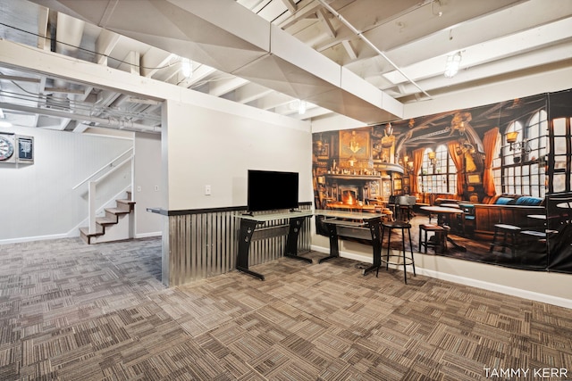 bar featuring carpet floors and stairs