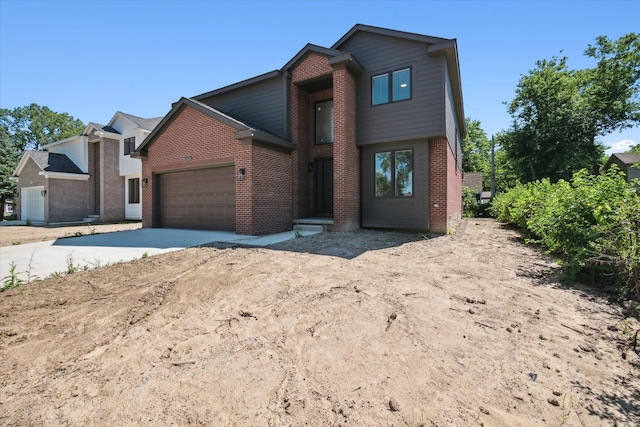 view of front of home featuring brick siding, concrete driveway, and a garage