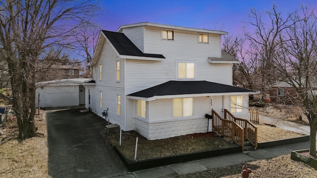 rear view of house featuring roof with shingles