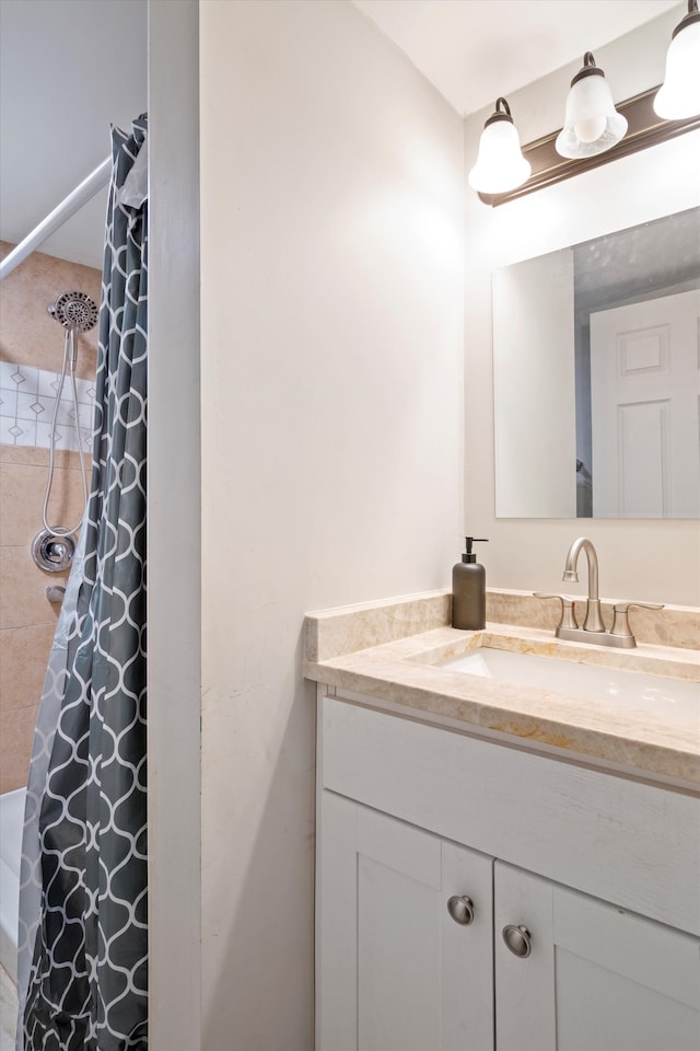 full bathroom with a shower with shower curtain and vanity