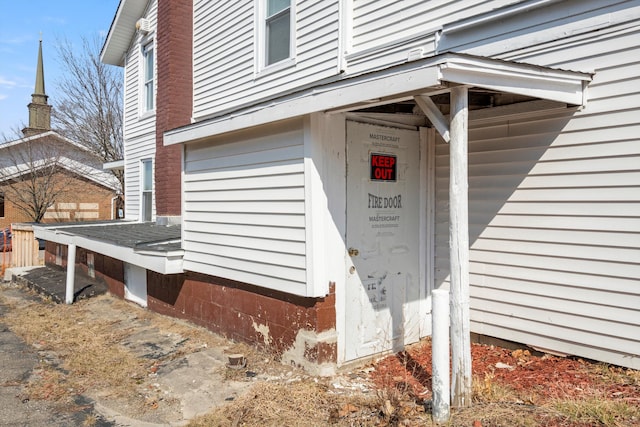 entrance to property with a chimney