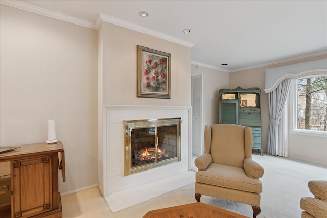 sitting room featuring light carpet, a fireplace with flush hearth, recessed lighting, crown molding, and baseboards