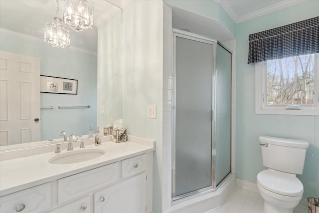 bathroom featuring vanity, ornamental molding, a shower stall, tile patterned floors, and toilet