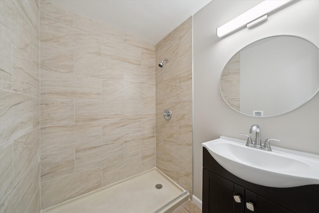 bathroom featuring vanity and a tile shower