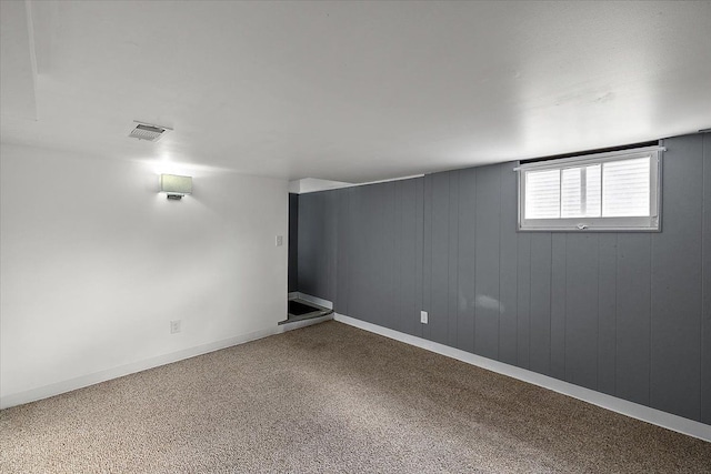 below grade area featuring visible vents and baseboards