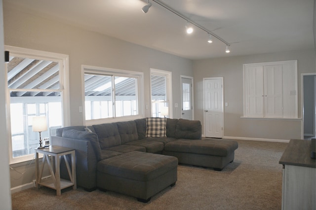 living room with baseboards and carpet flooring