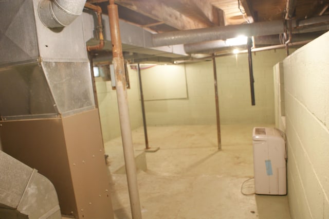 unfinished basement with heating unit