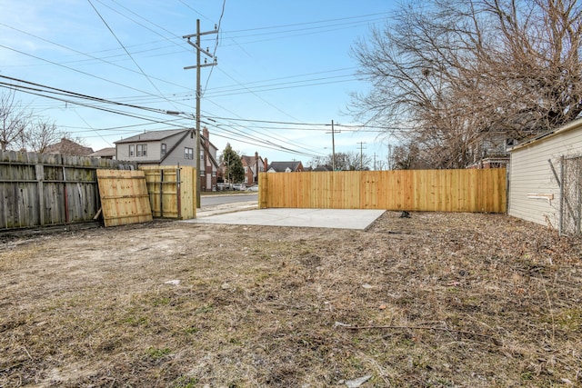 view of yard with a patio area and fence