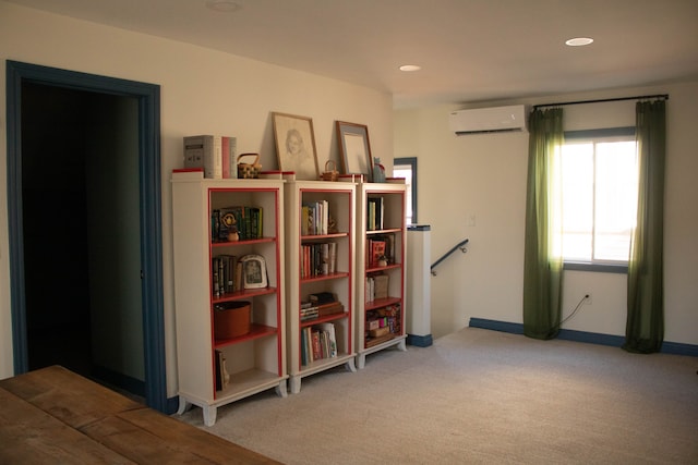 miscellaneous room with an AC wall unit, recessed lighting, an upstairs landing, and carpet floors