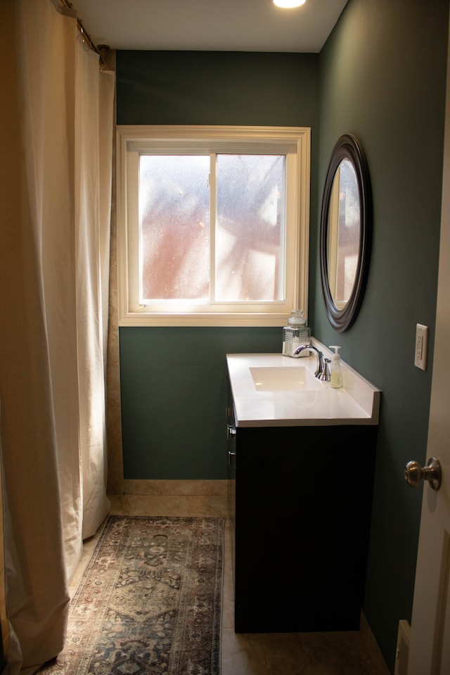 full bath with tile patterned floors and vanity