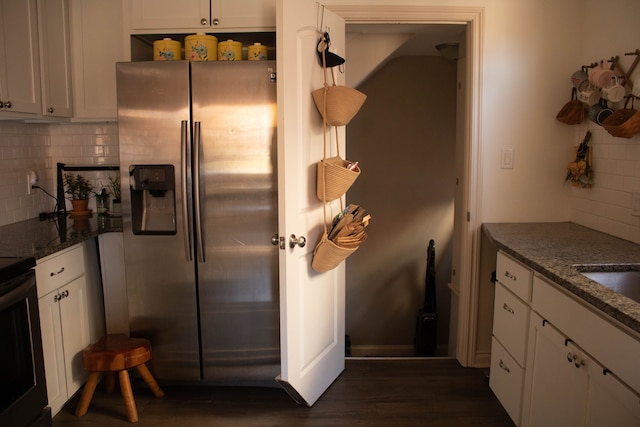 kitchen featuring white cabinetry, decorative backsplash, stainless steel fridge with ice dispenser, and dark wood-style flooring