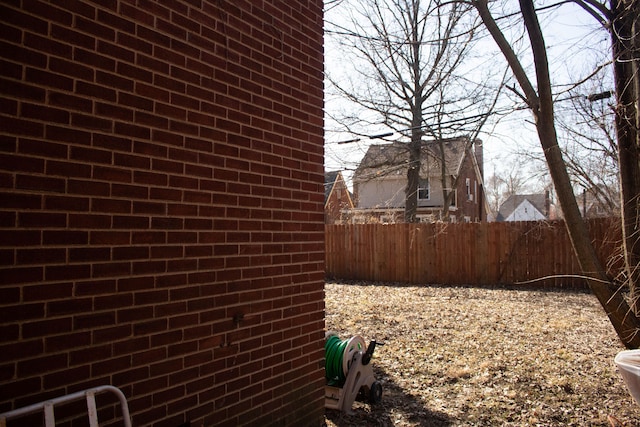 view of property exterior with fence