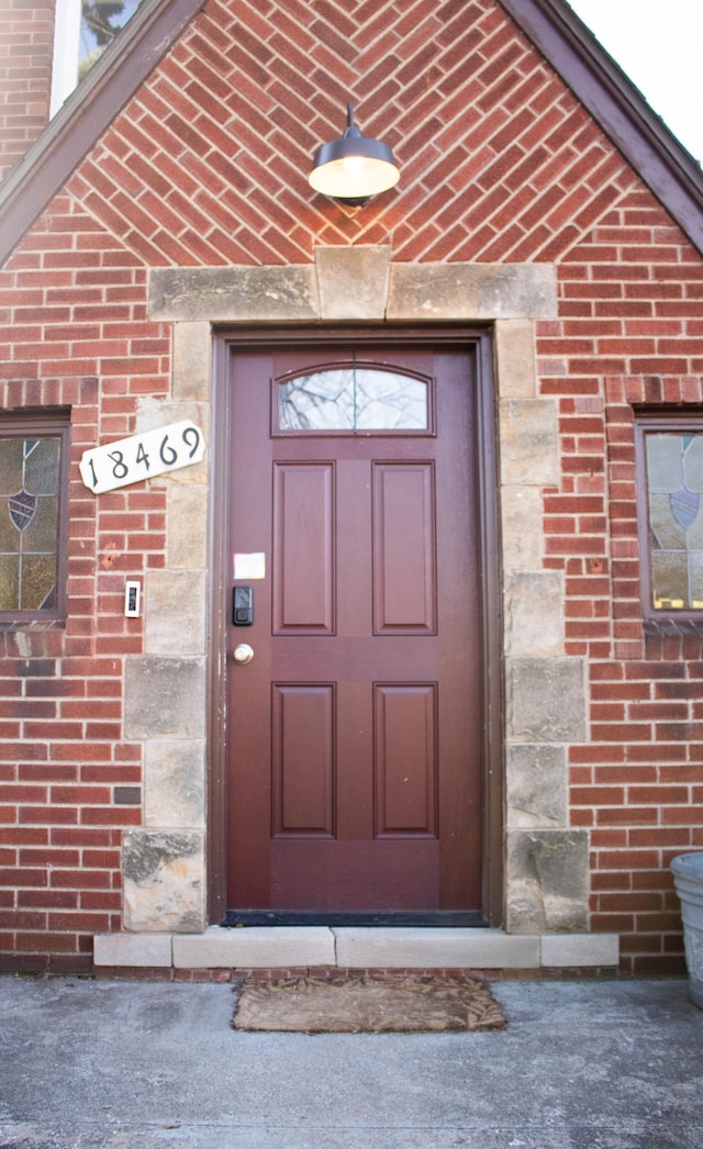 entrance to property with brick siding