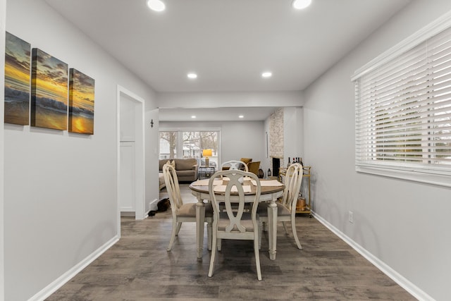 dining space with wood finished floors, recessed lighting, and baseboards