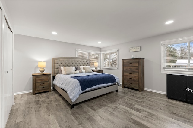 bedroom with recessed lighting, baseboards, and wood finished floors