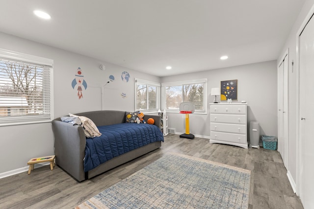 bedroom featuring light wood finished floors and recessed lighting