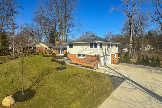 view of side of home featuring a garage, brick siding, concrete driveway, and a lawn